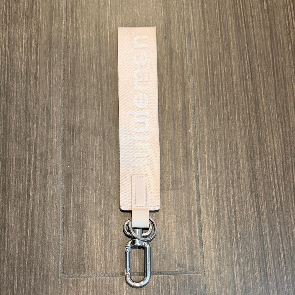 lululemon pale pink wrist strap key fob with silver hardware
